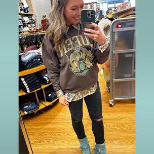 Image from @looks.like.lori on 7 Apr 2023 with caption: Are you ready… hey are you ready for this Are you hanging on the edge of your seat Christmas is almost here, and buckle gifts are under the tree and on me!! Layered a satin button up under this #queen pullover and the most amazing fringe boots ever!!! ❤️❤️❤️ Link in bio to shop the outfit, or comment/message me for info. #buckledout #bucklestyle #forthestyledlife #bandtees #fringe
